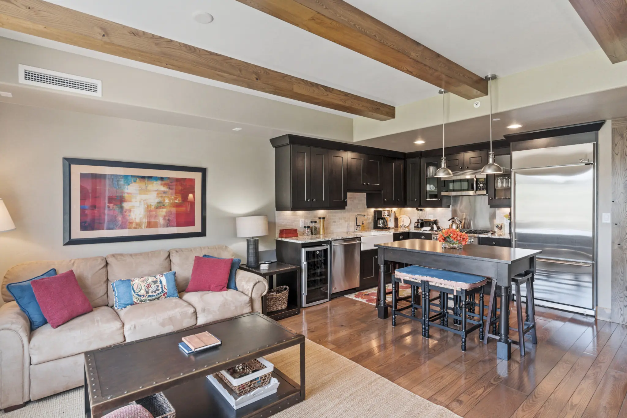 den and adjoining open kitchen