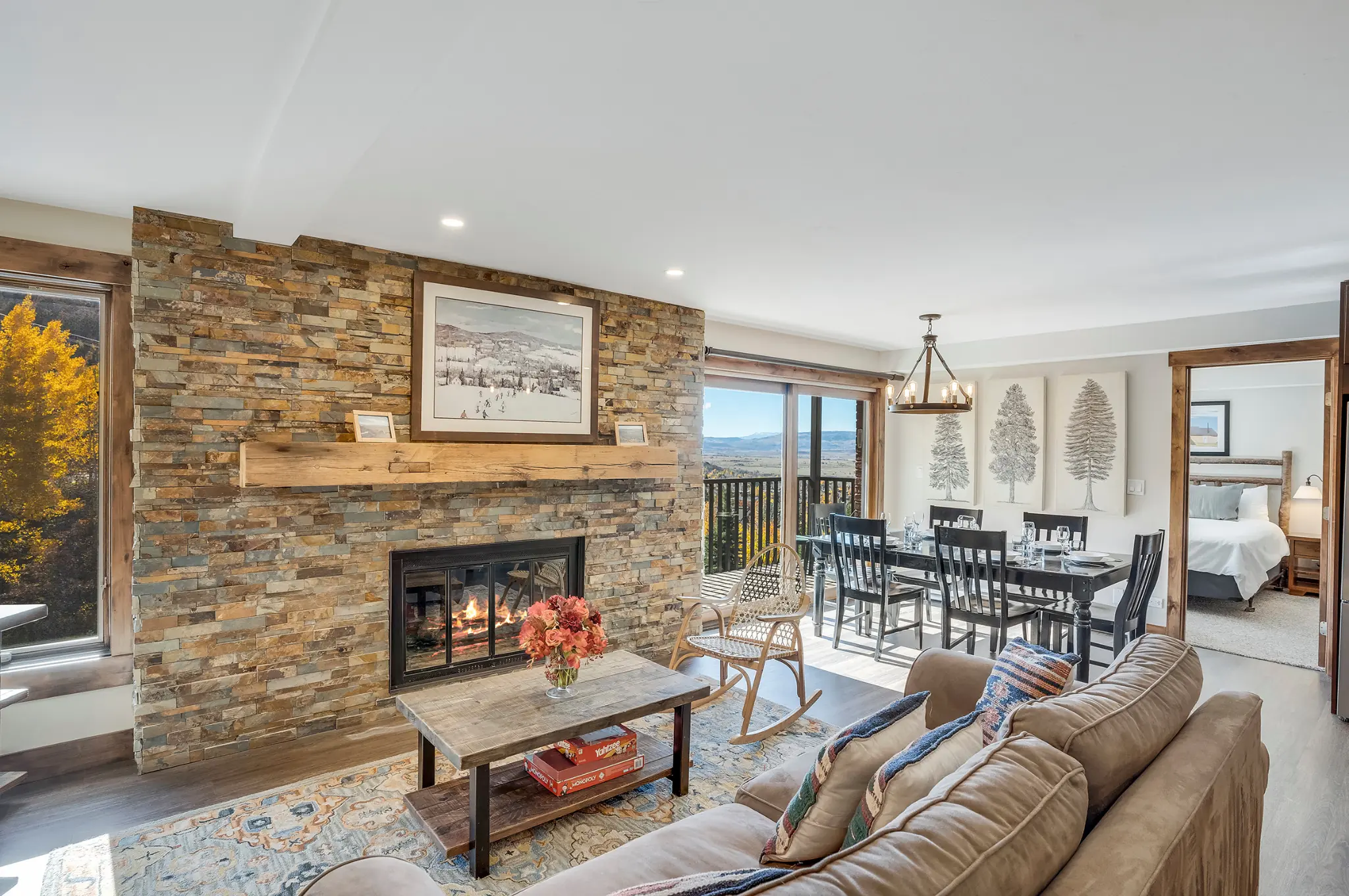Interior of a rental apartment, including fireplace, dining table