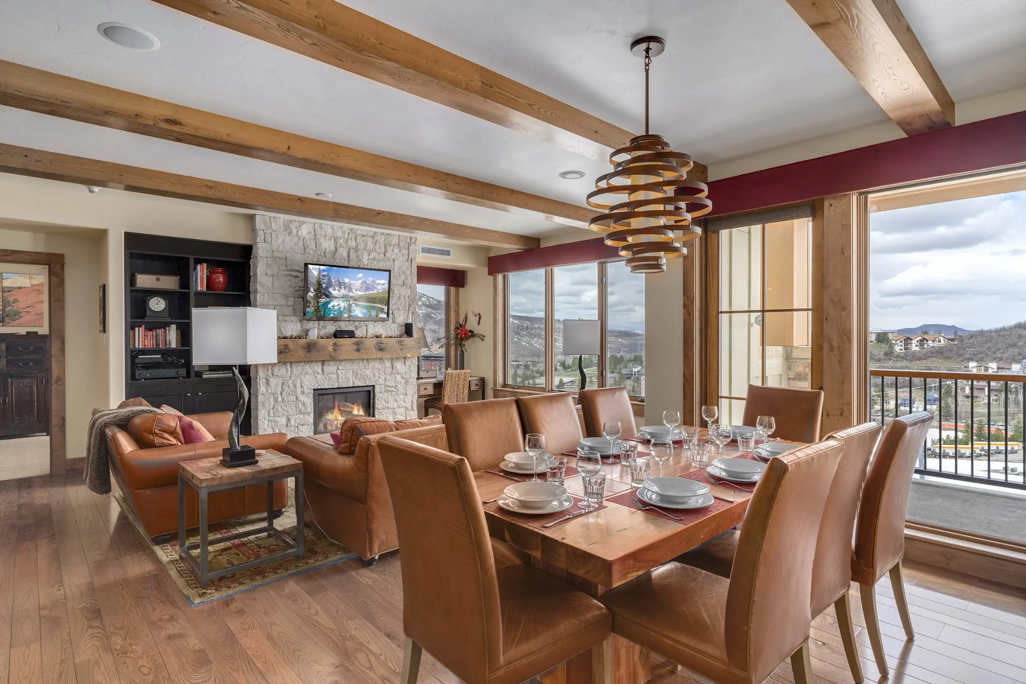 Dining area and adjoining den of an Edgemont rental, with balcony overlook